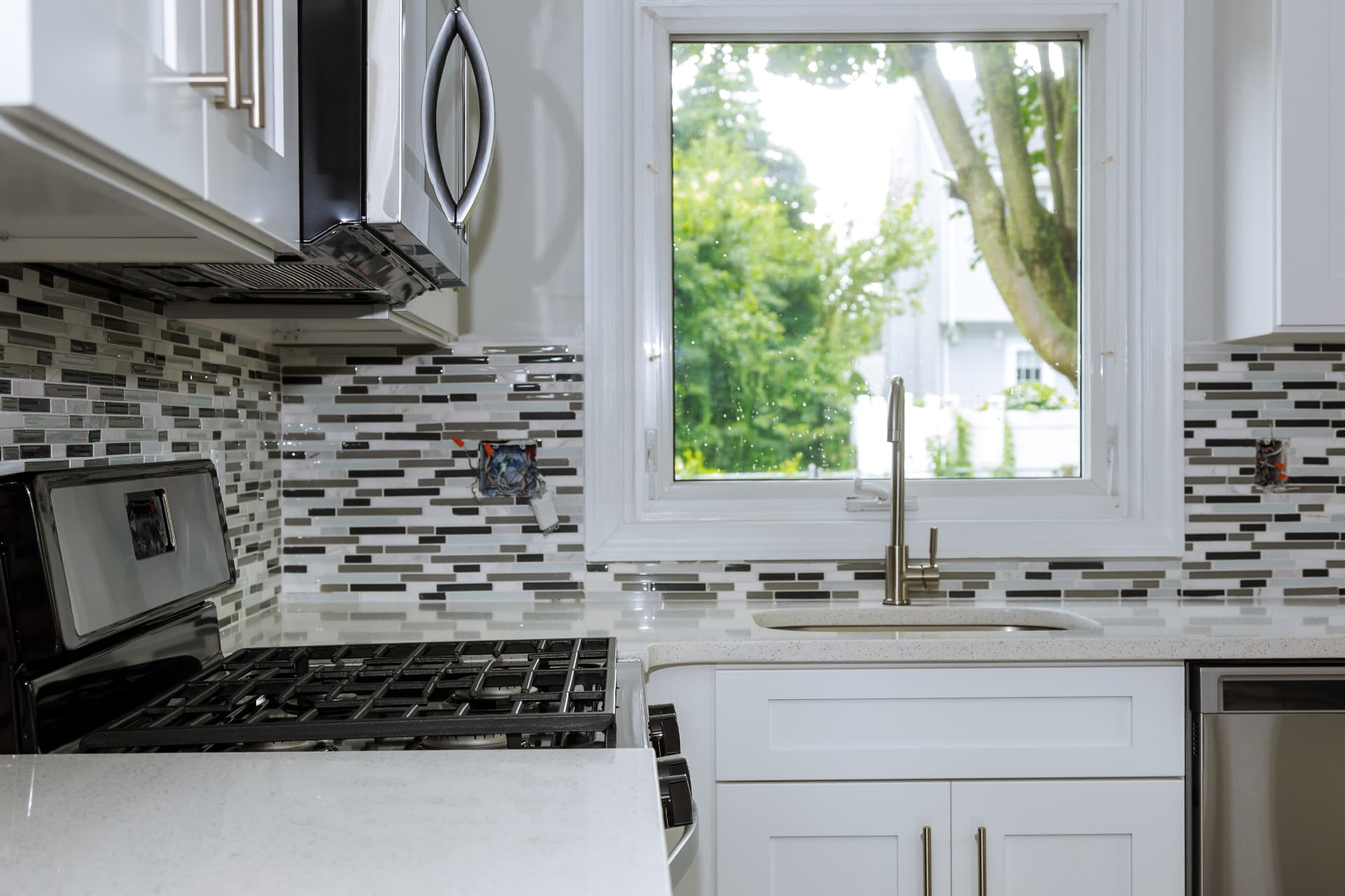 Roseville Open-Concept Kitchen, Load-bearing wall removed with a flush beam, full cabinetry replacement and a 10-foot quartz island.